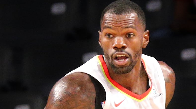 Hawks’ Dewayne Dedmon grabs a rebound against the Grizzlies during the second half in a NBA preseason basketball game on Monday, October 9, 2017, in Atlanta.   Curtis Compton/ccompton@ajc.com