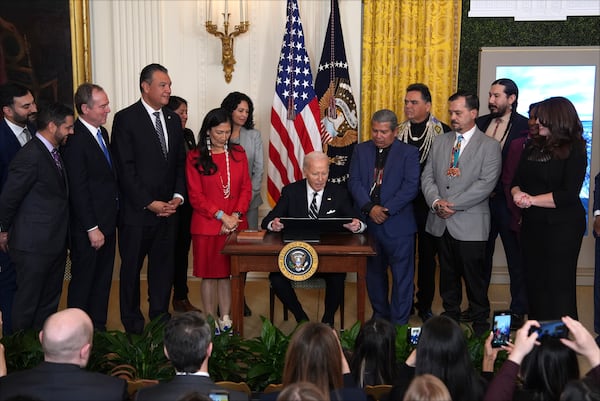 FILE - President Joe Biden signs a proclamation to establish the Chuckwalla National Monument and the Sáttítla Highlands National Monument during an event in the East Room of the White House, Jan. 14, 2025, in Washington. (AP Photo/Evan Vucci, File)