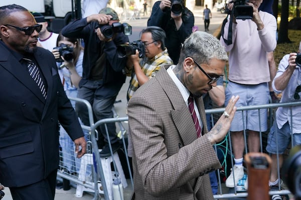 Grammy-winning singer Chris Brown makes his way into Southwark Crown Court, in London, Friday, July 11, 2025.(AP Photo/Alberto Pezzali)