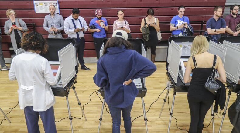 Voters waited over an hour to vote at Henry W. Grady High School in Atlanta on Tuesday, Nov. 6, 2018. JOHN SPINK / JSPINK@AJC.COM