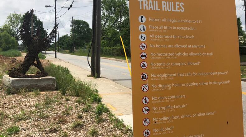 Two kids are accused of attacking men with baseball-sized rocks and waving a gun at them.