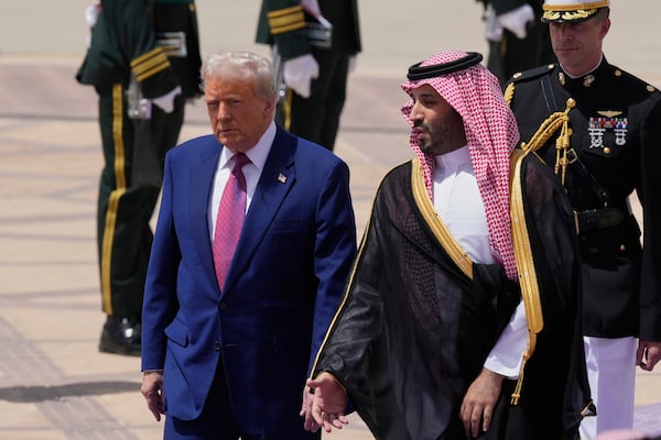 President Donald Trump speaks with Saudi Crown Prince Mohammed bin Salman during an arrival ceremony at the Royal Terminal of King Khalid International Airport in Riyadh, Saudi Arabia, Tuesday, May 13, 2025