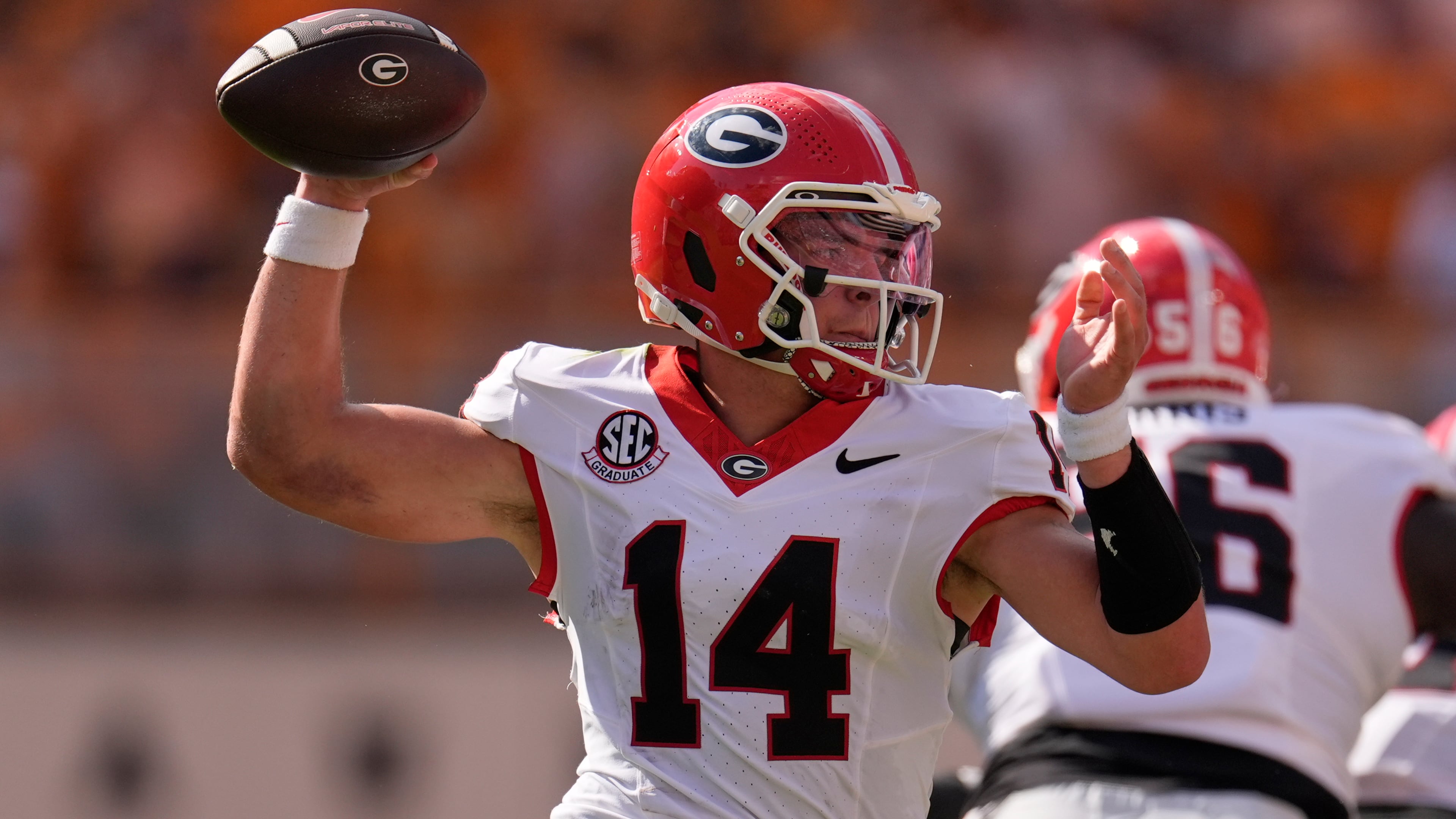 Georgia quarterback Gunner Stockton (14) looks to throw a pass during the first half of an NCAA college football game against Tennessee, Saturday, Sept. 13, 2025, in Knoxville, Tenn. (AP Photo/George Walker IV)