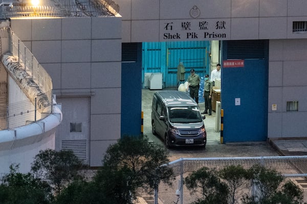 FILE -Vehicles believed to be carrying former pro-democracy lawmaker Gary Fan, who was released after four years for his conviction under the national security law, leaves the Shek Pik Prison in Hong Kong, April 29, 2025. (AP Photo/Chan Long Hei, File)