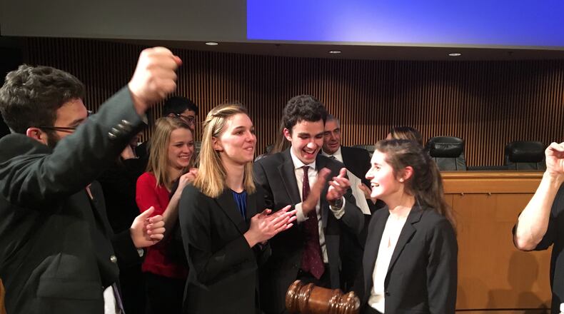 Students from Grady High School’s Mock Trial team celebrate taking top honors in the state.