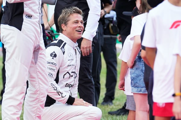 FILE - Actor Brad Pitt appears on the grid before the British Formula One Grand Prix race at the Silverstone racetrack, Silverstone, England on July 9, 2023. (AP Photo/Luca Bruno, File)