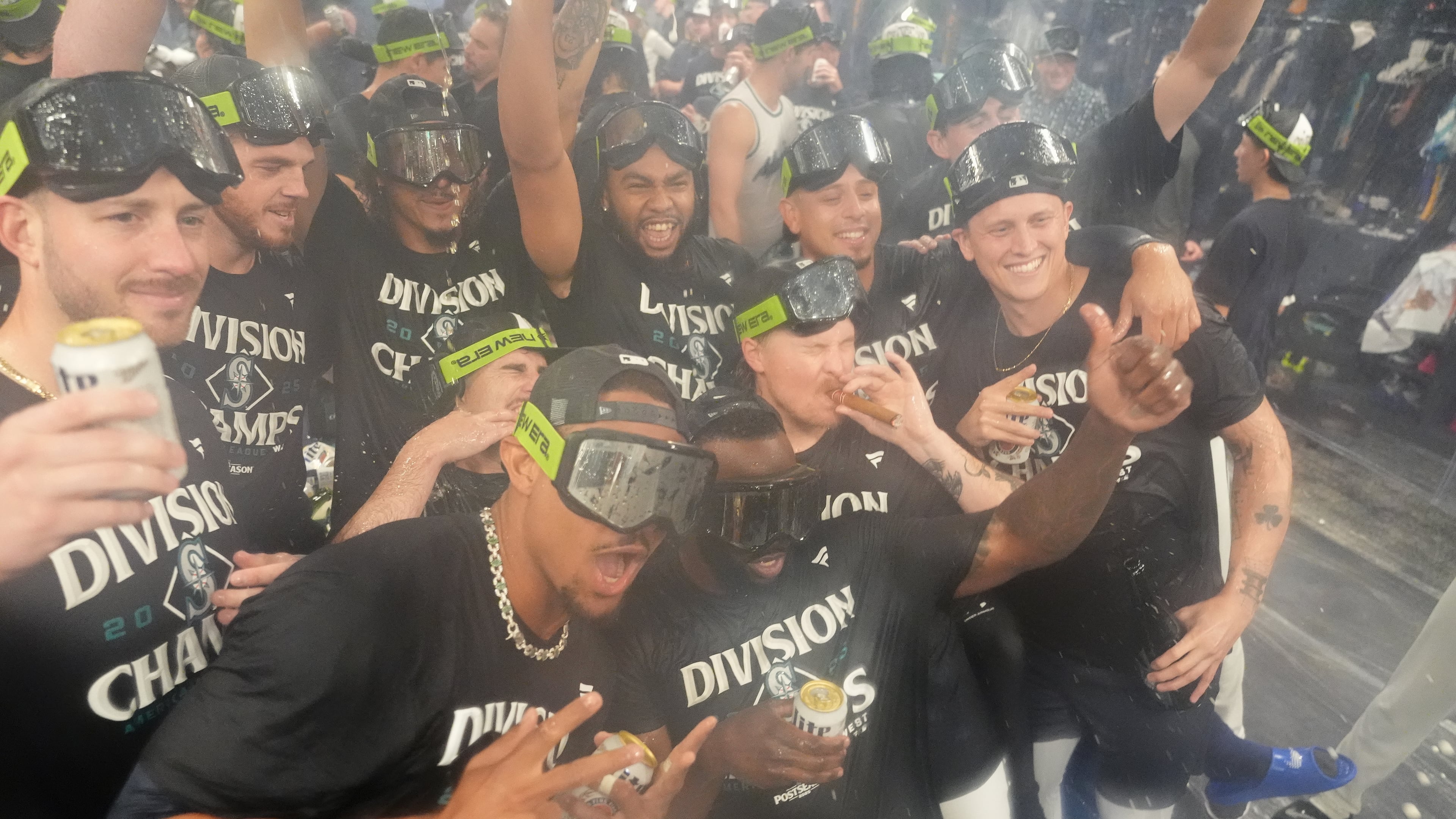 The Seattle Mariners celebrate after the team's win against the Colorado Rockies to clinch the American League West Division, Wednesday, Sept. 24, 2025, in Seattle. (AP Photo/Ryan Sun)