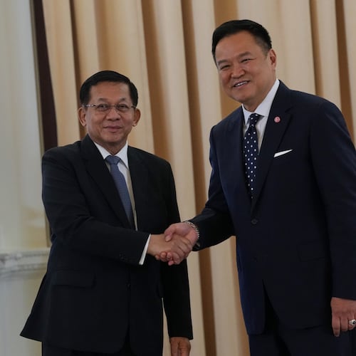 Myanmar President Min Aung Hlaing, left, shakes hands with Thailand's Prime Minister Anutin Charnvirakul at the government house in Bangkok, Thailand, Thursday, Aug. 6, 2026. (AP Photo/Sakchai Lalit)