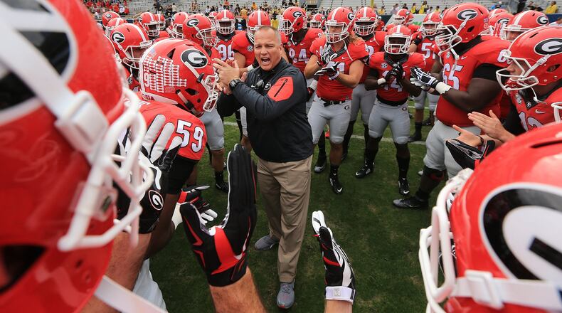 Richt fires up his team as they prepare to play Georgia Tech in their rivalry football game on Nov. 28 in Atlanta. The Dogs won, but Richt was fired the next day. Curtis Compton / ccompton@ajc.com