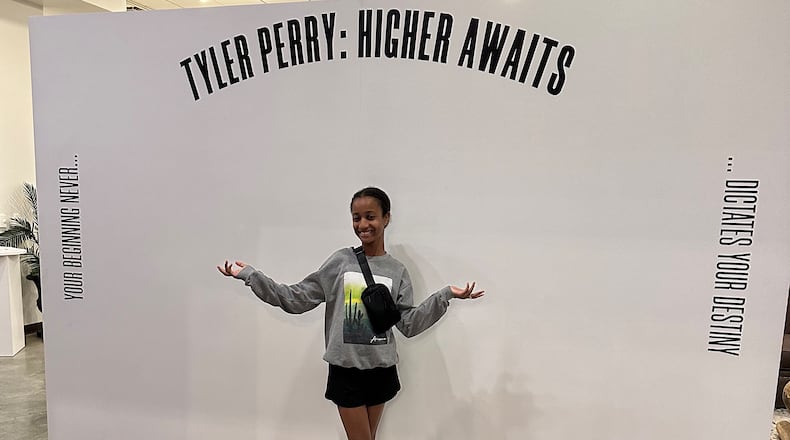Layla, 12, enjoyed the Tyler Perry exhibit at the Tubman Museum in Macon. The exhibit, which opened in 2023, documents Perry's career and includes interactive elements that appeal to younger audiences. (Nedra Rhone / nrhone@ajc.com)