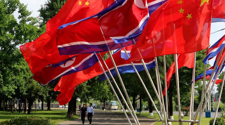 A street is decorated with the flags of China and North Korea in Pyongyang, on Monday, June 8, 2026. (AP Photo/Jon Chol Jin)