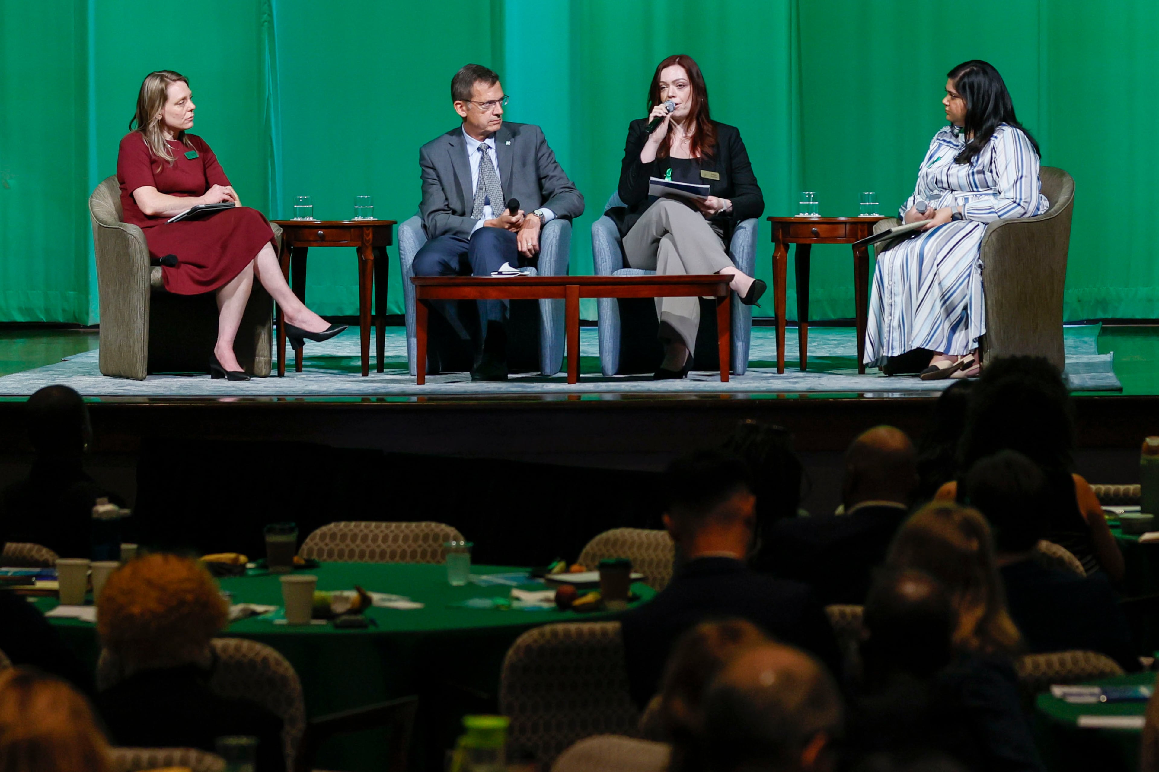 Sarah Phillips (second from the right), associate director of Mental Health Programs at The Carter Center, speaks on the panel "Mental Health Parity Act Implementation in Georgia" during the 29th annual Rosalynn Carter Mental Health Forum at the Carter Center on Tuesday. (Miguel Martinez/AJC)