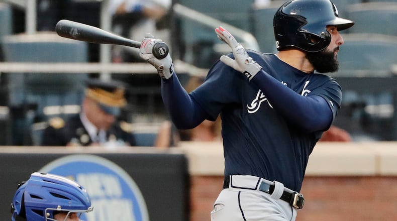 Atlanta Braves' Nick Markakis follows through on a two-run double during the sixth inning of the first baseball game of a doubleheader against the New York Mets, Monday, Sept. 25, 2017, in New York. (AP Photo/Frank Franklin II)