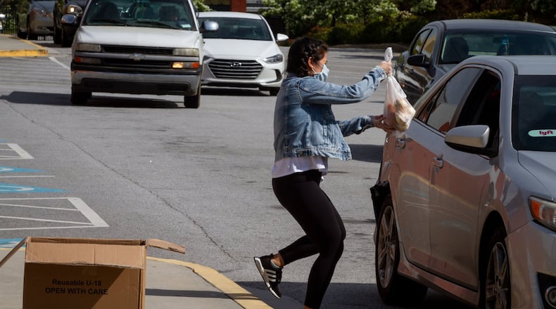 Atlanta Public Schools provided 160,000 meals weekly during the school year to help families during the coronavirus closures. In June, the district will scale down its food distribution program but still offer meals through four partner organizations. AJC file photo. STEVE SCHAEFER / SPECIAL TO THE AJC