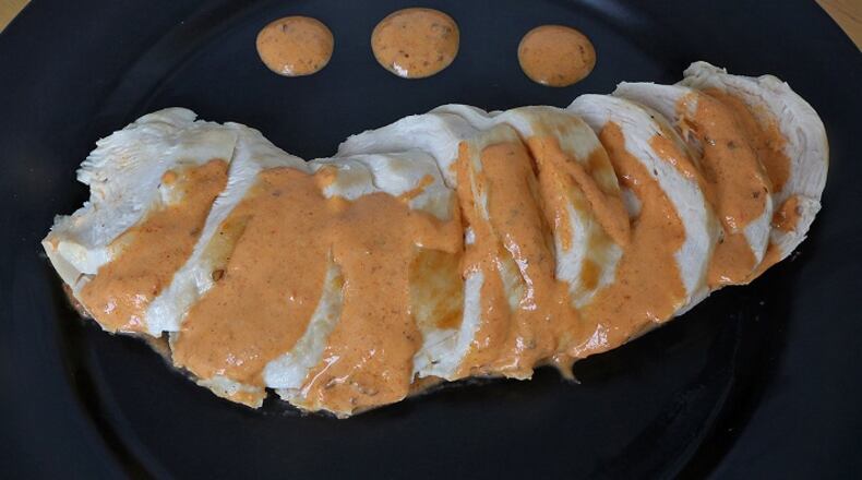 Chicken with yogurt harissa sauce is one of the twelve meat dishes created with chicken, beef, or pork on Wednesday, July 26, 2017, at the St. Louis Post-Dispatch.
(J.B. Forbes/St. Louis Post-Dispatch/TNS)