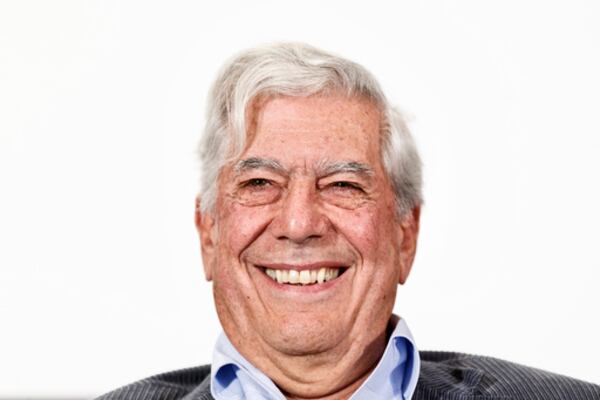 FILE - Peruvian writer and Nobel Prize winner in literature Mario Vargas Llosa smiles during a press conference at the presentation of a new theatre play in Madrid, Spain, April 24, 2013. (AP Photo/Daniel Ochoa de Olza, File)