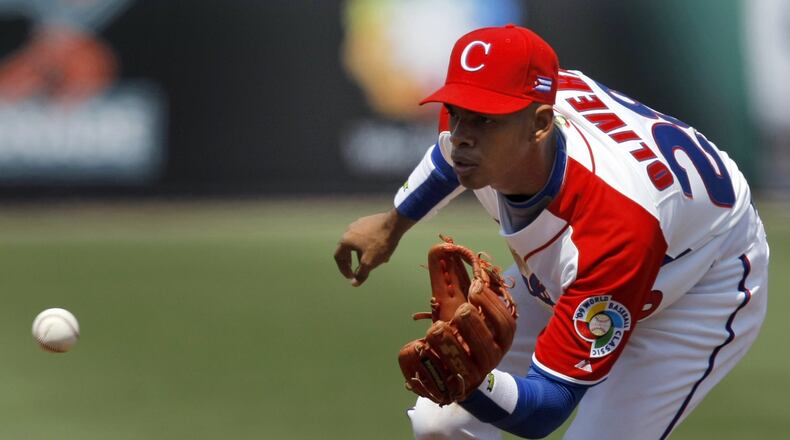 Hector Olivera, shown here in the 2009 World Baseball Classic, is expected to major his major league debut with the Braves soon, but it might not be until at least later in the week. (AP Photo/Gregory Bull, File)