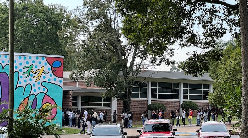 Students wait outside Cross Keys High School on Wednesday, Aug. 9, 2023, to go through the district's new Evolv weapons detection system before classes start. By the time the school day started, there was no line. (Cassidy Alexander/cassidy.alexander@ajc.com)