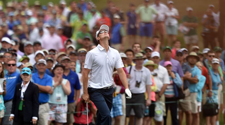 Justin Rose reacts after almost holing a chip from the rough for a birdie on No. 7 during the final round of the Masters on Sunday at Augusta National. (BRANT SANDERLIN/BSANDERLIN@AJC.COM)