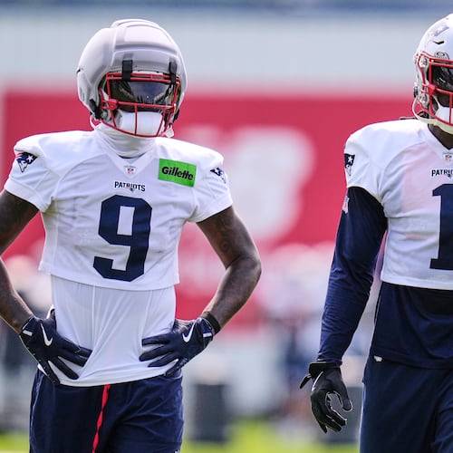 New England Patriots wide receivers A.J. Brown (1) and Kayshon Boutte (9) wait their turn on a drill during the team's NFL football training camp, Monday, Aug. 10, 2026, in Foxborough, Mass. (AP Photo/Charles Krupa)