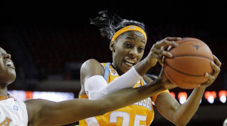 Tennessee's Glory Johnson (25) grabs a rebound over Texas' Ashley Gayle, left, during the second half of an NCAA women's basketball game, Sunday, Dec. 12, 2010 in Austin, Texas. Tennessee won 92-77.