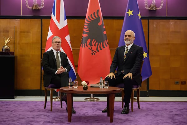 Britain's Prime Minister Keir Starmer, left, is welcomed by Albania's Prime Minister Edi Rama at the Kryeministria in Tirana, Albania, Thursday May 15, 2025. (Leon Neal/Pool via AP)