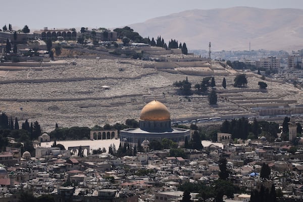 A view of Jerusalem's Old City, with the Dome of the Rock shrine in the Al-Aqsa Mosque compound, closed to worshippers after Israel's Homefront Command banned public gatherings following an Israeli military strike on Iran, Friday, June 13, 2025. (AP Photo/Ohad Zwigenberg)