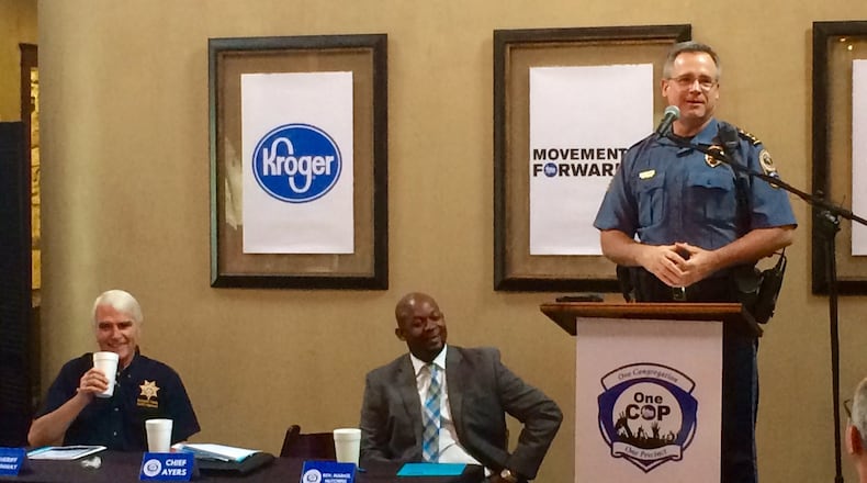 The Rev. Markel Hutchins (center) enjoys a light moment on Thursday, May 11, 2017, with Gwinnett County’s two law enforcement Butches — Sheriff Butch Conway (left) and Police Chief Butch Ayers (right). Photo by Bill Torpy