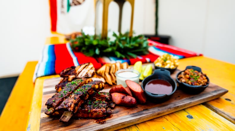 The Backyard BBQ Board is available for groups in Ladybird's cozy new Base Camp Tents.