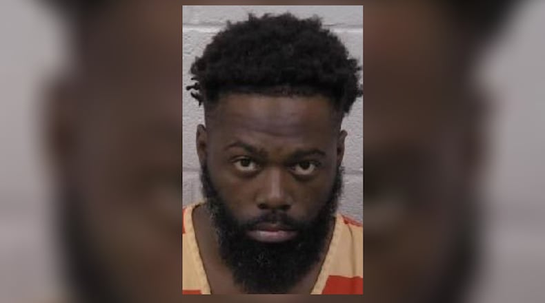 Charlie Wilson Moore, 35, was being held without bond late Monday.