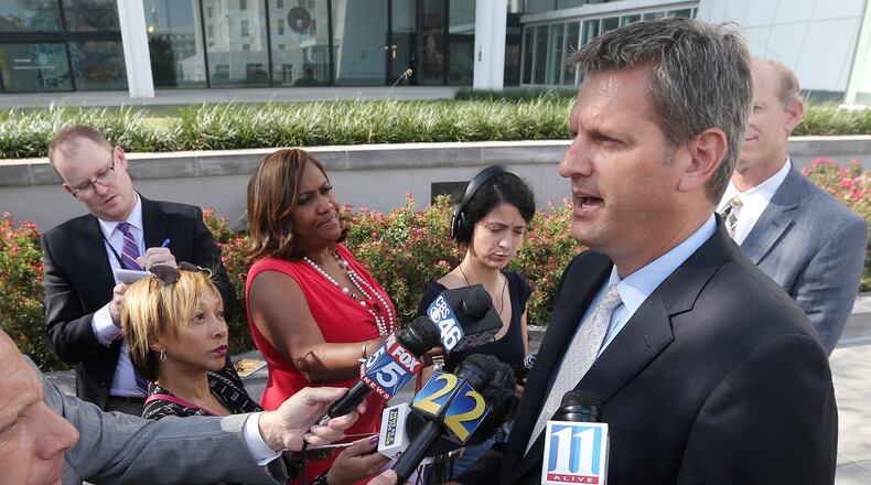 John Horn addresses the news media in September as U.S. Attorney after Adam L. Smith pleaded guilty to accepting more than 30,000 in bribes. Curtis Compton/ccompton@ajc.com