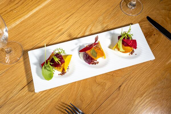 A salad of ruby red and golden beets, crispy quinoa and meyer lemon yogurt prepared by Aria's outgoing executive chef Gerry Klaskala. (Arvin Temkar/AJC)