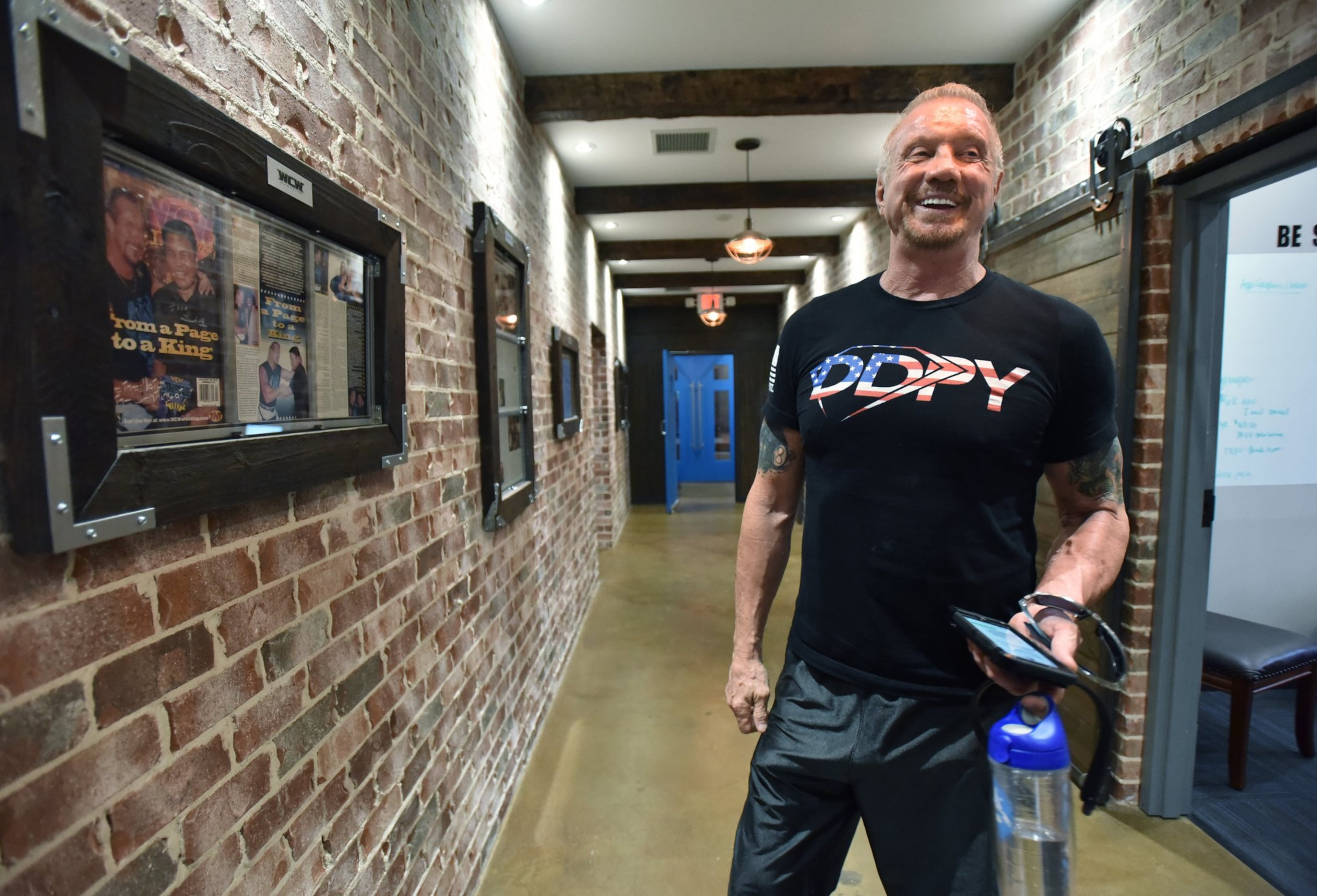Diamond Dallas Page, a three-time WCW champion, shows off DDP Yoga Performance Center in Smyrna on Aug. 20, 2019. (Hyosub Shin/AJC)