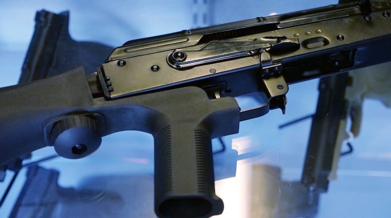 A little-known device called a "bump stock" is attached to a semi-automatic rifle at the Gun Vault store and shooting range in South Jordan, Utah. AP/Rick Bowmer
