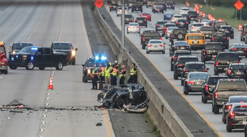June 27, 2023 Roswell:  A fatal crash blocked all northbound lanes of Ga. 400 at Holcomb Bridge Road in Roswell for five hours Tuesday morning, June 27, 2023. The two-vehicle wreck was first reported around 3:30 a.m., according to the Georgia Department of Transportation. Roswell police confirmed two fatalities but did not provided any other details on what caused the collision. During a crash investigation, the northbound lanes were closed between Northridge and Holcomb Bridge roads, forcing traffic off at the Northridge exit. Ga. 400 was jammed leaving Sandy Springs as a result. The lanes reopened shortly after 8 a.m., and delays remain all through the northern suburbs, according to the WSB 24-hour Traffic Center. Police said more information will be released once they’ve processed the investigative findings, which include drone footage. (John Spink / John.Spink@ajc.com)