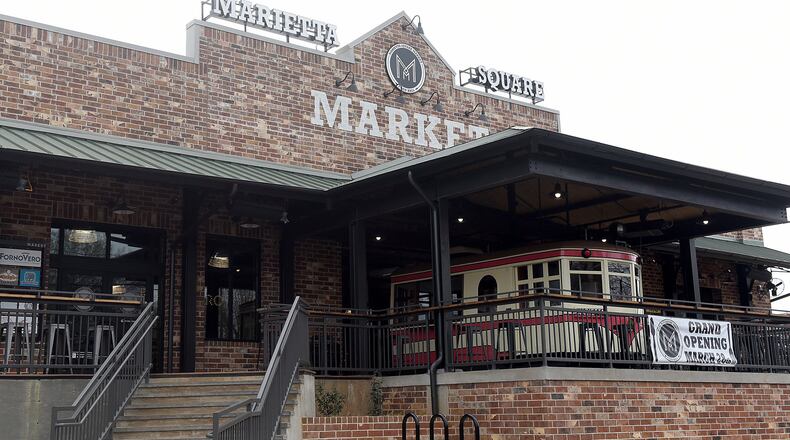 The Trolley on display at the main entrance to Marietta Square Market will become home to Pulp Addiction later this summer. RYON HORNE / RHORNE@AJC.COM