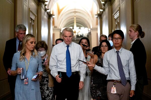 Sen. Rob Portman discusses the infrastructure bill with reporters on Capitol Hill in Washington. Portman acknowledged that Republicans are insistent that an infrastructure deal not include provisions to toughen tax enforcement at the IRS. (Stefani Reynolds/The New York Times)   ..