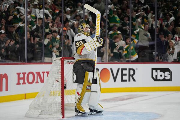 Vegas Golden Knights goaltender Adin Hill (33) stands in the goal after a goal scored by Minnesota Wild center Marco Rossi (23) during the first period of Game 3 of a first-round NHL hockey playoff series Thursday, April 24, 2025, in St. Paul, Minn. (AP Photo/Abbie Parr)