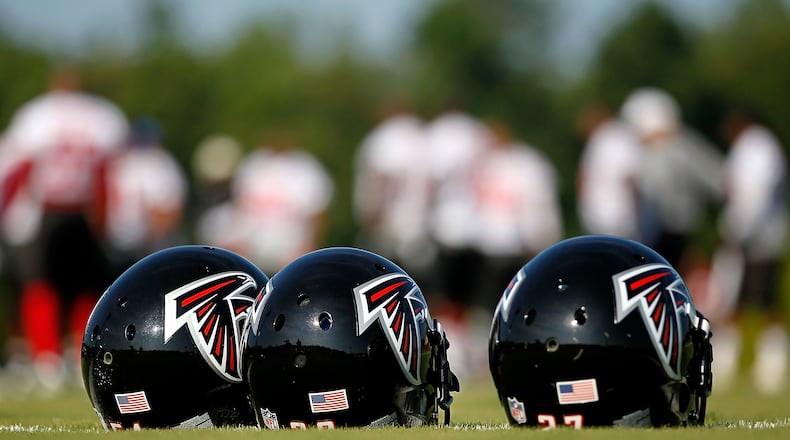 Helmets sit on the ground during the Atlanta Falcons workout on opening day of training camp on July 30, 2010, at the Falcons Training Complex in Flowery Branch.
