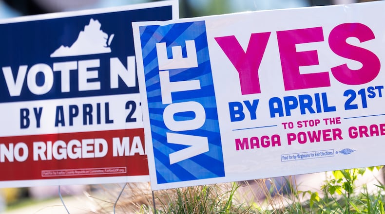 Signs are seen outside Fairfax Government Center during the Virginia redistricting referendum, Tuesday, April 21, 2026, in Fairfax, Va. (AP Photo/Julia Demaree Nikhinson)