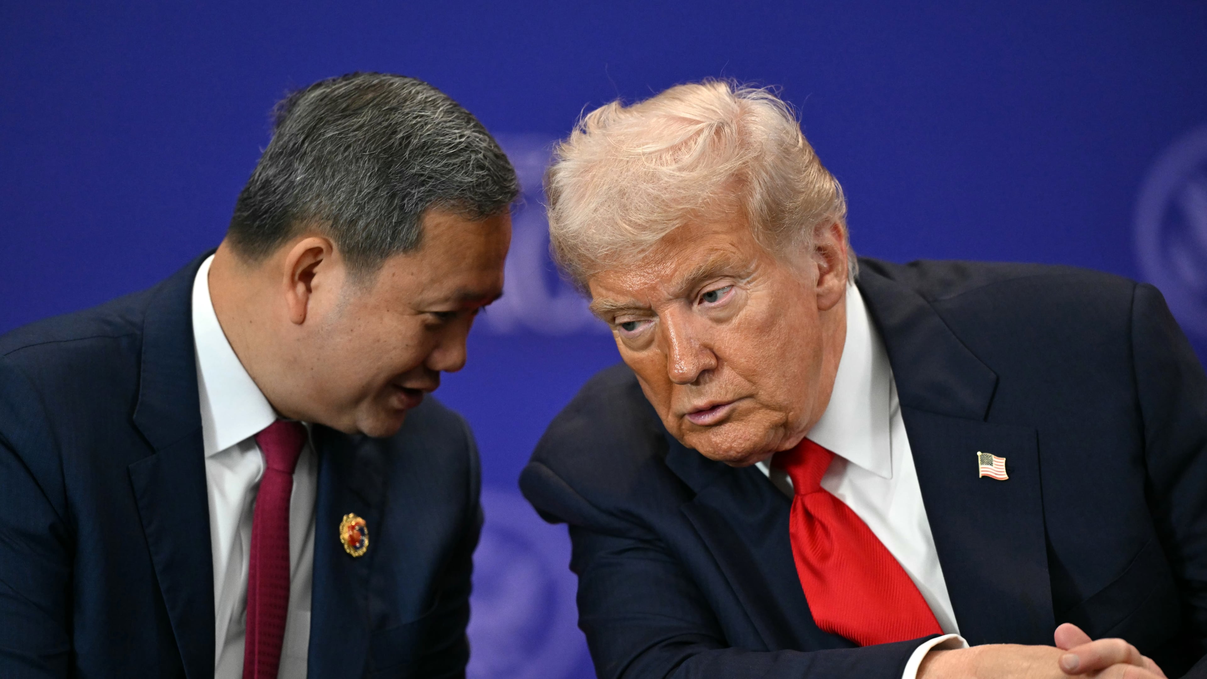 U.S. President Donald Trump listens to Cambodia's Prime Minister Hun Manet, left, ahead of the ceremonial signing of a ceasefire agreement between Thailand and Cambodia on the sidelines of the 47th Association of Southeast Asian Nations (ASEAN) summit in Kuala Lumpur, Malaysia, Sunday, Oct. 26, 2025. (Mohd Rasfan/Pool Photo via AP)