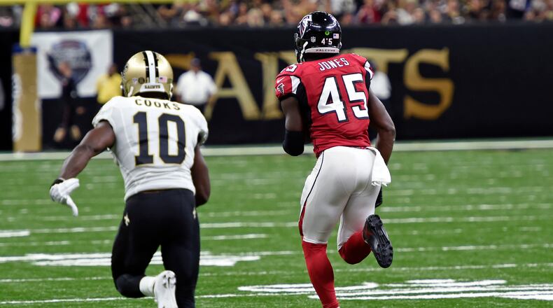 Falcons rookie linebacker Deion Jones intercepts a pass from New Orleans quarterback Drew Brees and returns it 90 yards for a touchdown in the fourth quarter of Monday night's game. The Falcons won the game 45-32. (AP photo)