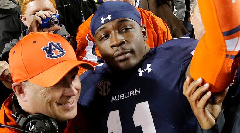 Auburn cornerback Chris Davis celebrates after returning a missed field-goal attempt to score the game-winning touchdown as time expired against No. 1 Alabama on Saturday.