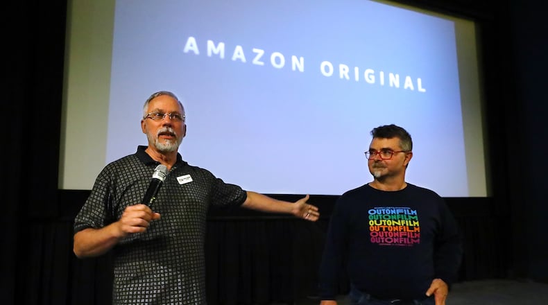 Jim Farmer (right), director of the Out on Film Festival in Atlanta, and his husband Craig Hardesty (left), board chair, address the audience at the Landmark Midtown Art Cinema before a preview of two episodes of "A League of Their Own," a streaming remake of the Penny Marshall movie on Monday, August 8, 2022, in Atlanta. Curtis Compton / Curtis Compton@ajc.com