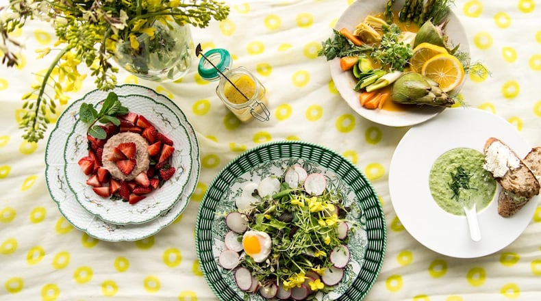 With spring in the air and more farmers markets starting to open around metro Atlanta, you can put your produce to great use in dishes such as Rhubarb Panna Cotta With Mint and Macerated Strawberries (left), Spring Lettuces With Radishes, Edible Flowers, Egg and Elderflower Dressing (center), Provencal Barigoule With Early Spring Vegetables (upper right) and Spring Pea Soup With Goat Cheese Crostini (right). STYLING BY LISA HANSON / CONTRIBUTED BY MIA YAKEL