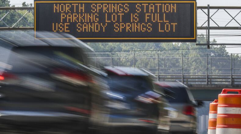 October 3, 2019 Fulton County: A GDOT electronic signboard informs southbound GA 400 commuters that the parking lot is full at the North Springs MARTA Station on Thursday, Oct 3, 2019. MARTA is negotiating with AT&T to buy the parking decks at the busy North Springs station along with Doraville and College Park stations. The lots would open up 2,100 spots to train riders. Those are all the resident-used north and south endpoints of the train. There’s no price, but AT&T has been leasing for land forever. JOHN SPINK/JSPINK@AJC.COM