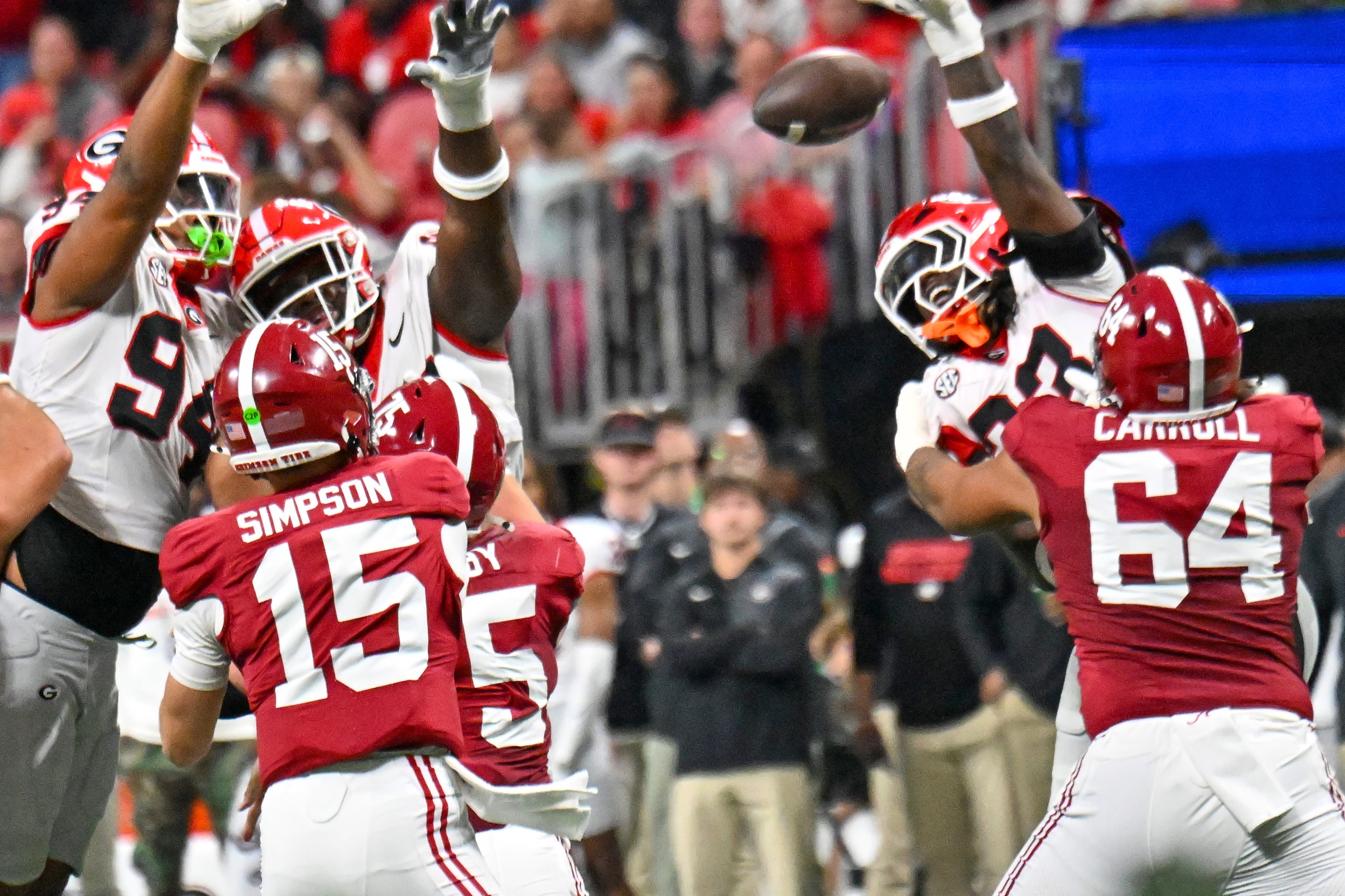 Alabama quarterback Ty Simpson (15) attempts to throw under pressure from the Georgia defense during the first half of the SEC Championship game at Mercedes-Benz Stadium, Saturday, Dec. 6, 2025, in Atlanta. (Hyosub Shin / AJC)