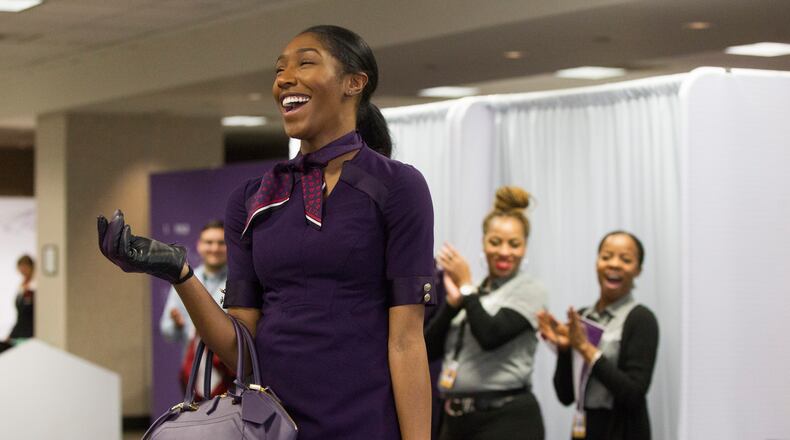Kyandra Ravenel, a Delta airlines flight attendant, walks the runway during the uniform fitting for Delta employees at Hartsfield-Jackson Atlanta International Airport in Atlanta, Georgia, on Wednesday, February 7, 2018. (REANN HUBER/REANN.HUBER@AJC.COM)
