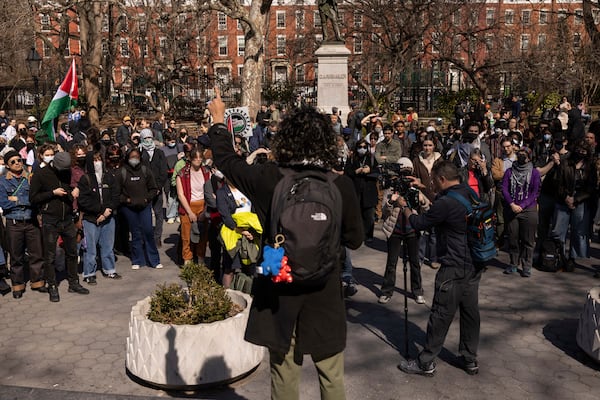 A protester including students of New York University gather for a demonstration in support of Palestinian activist Mahmoud Khalil at Washington Square Park, Tuesday, March 11, 2025, in New York. (AP Photo/Yuki Iwamura)