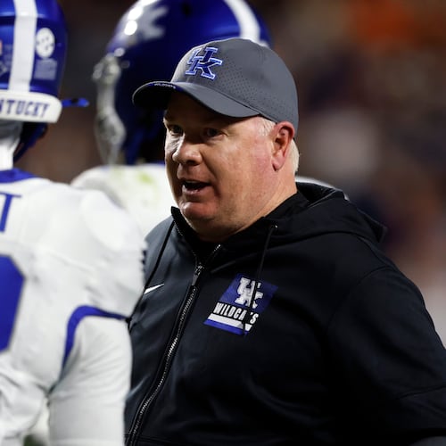 Kentucky head coach Mark Stoops talks with players during a timeout in the first half of an NCAA college football game against Auburn, Saturday, Nov. 1, 2025, in Auburn, Ala. (AP Photo/Butch Dill)